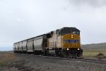 UP SD59MX #9907 leads the Cache Valley Local (LCG-41E) approaching the 4800 W. 900N. grade xing in Trenton, Utah. April 15, 2022